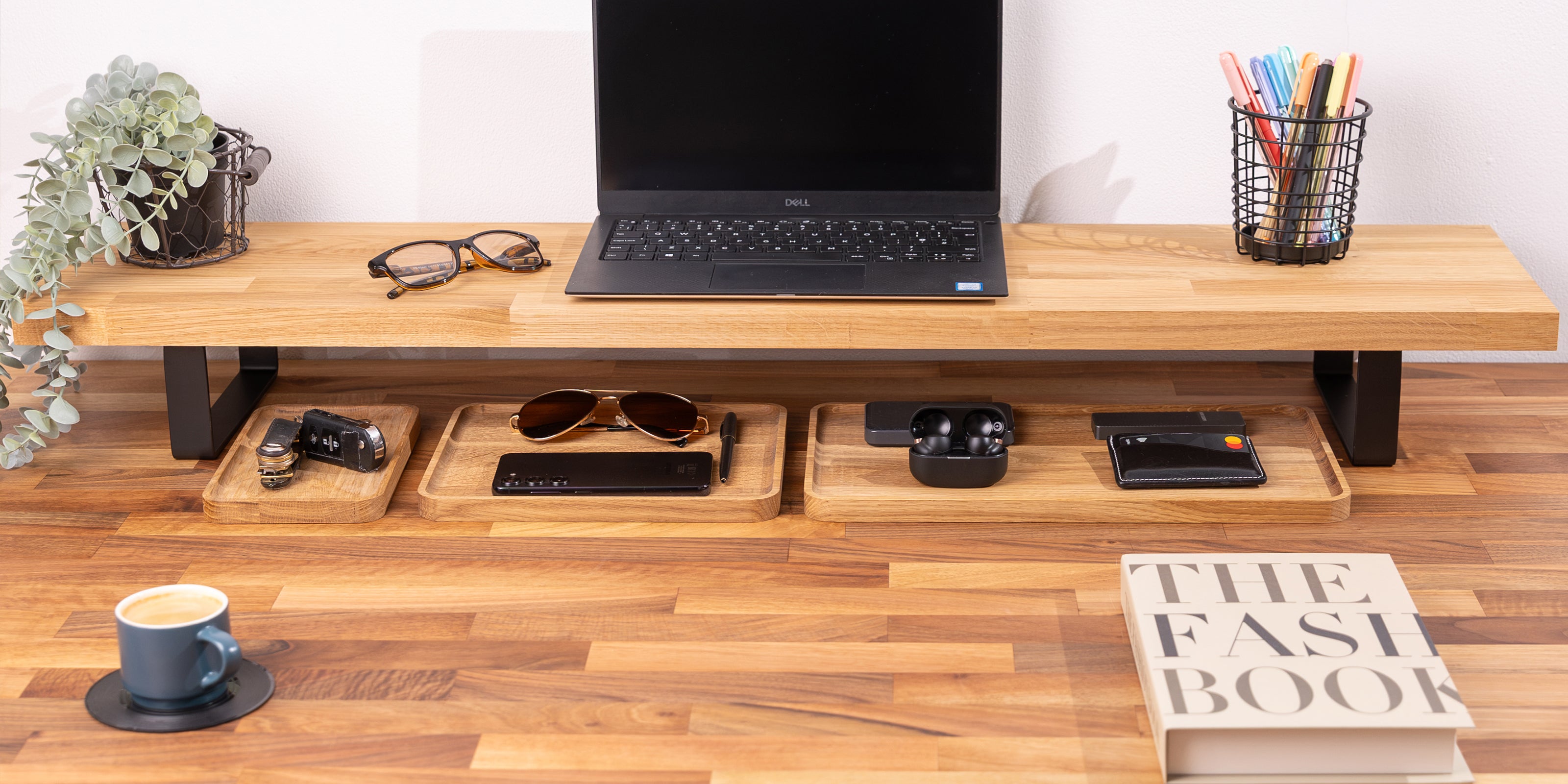Solid oak monitor stand paired with a walnut desktop and oak desk organisers.