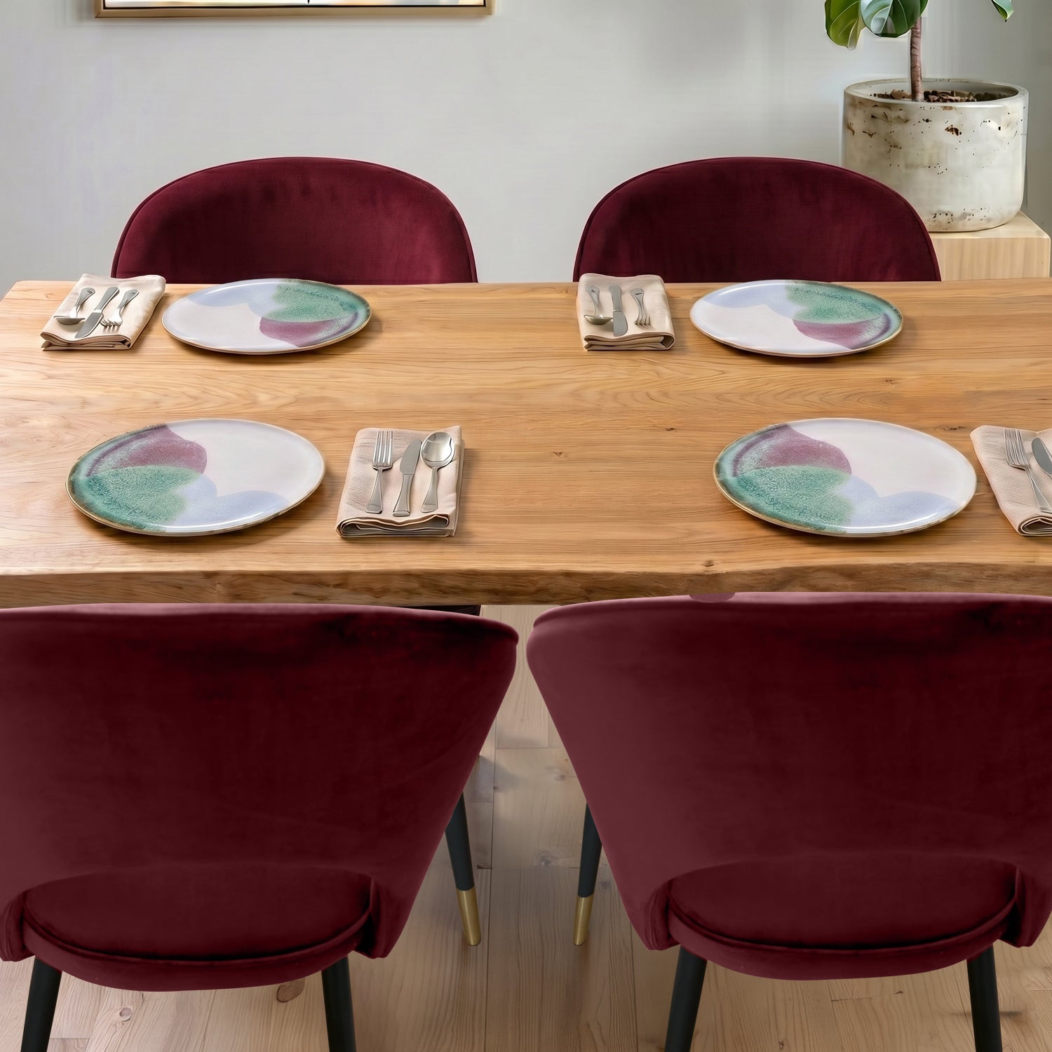 A curved velvet dining chair with a calm, sculptural feel