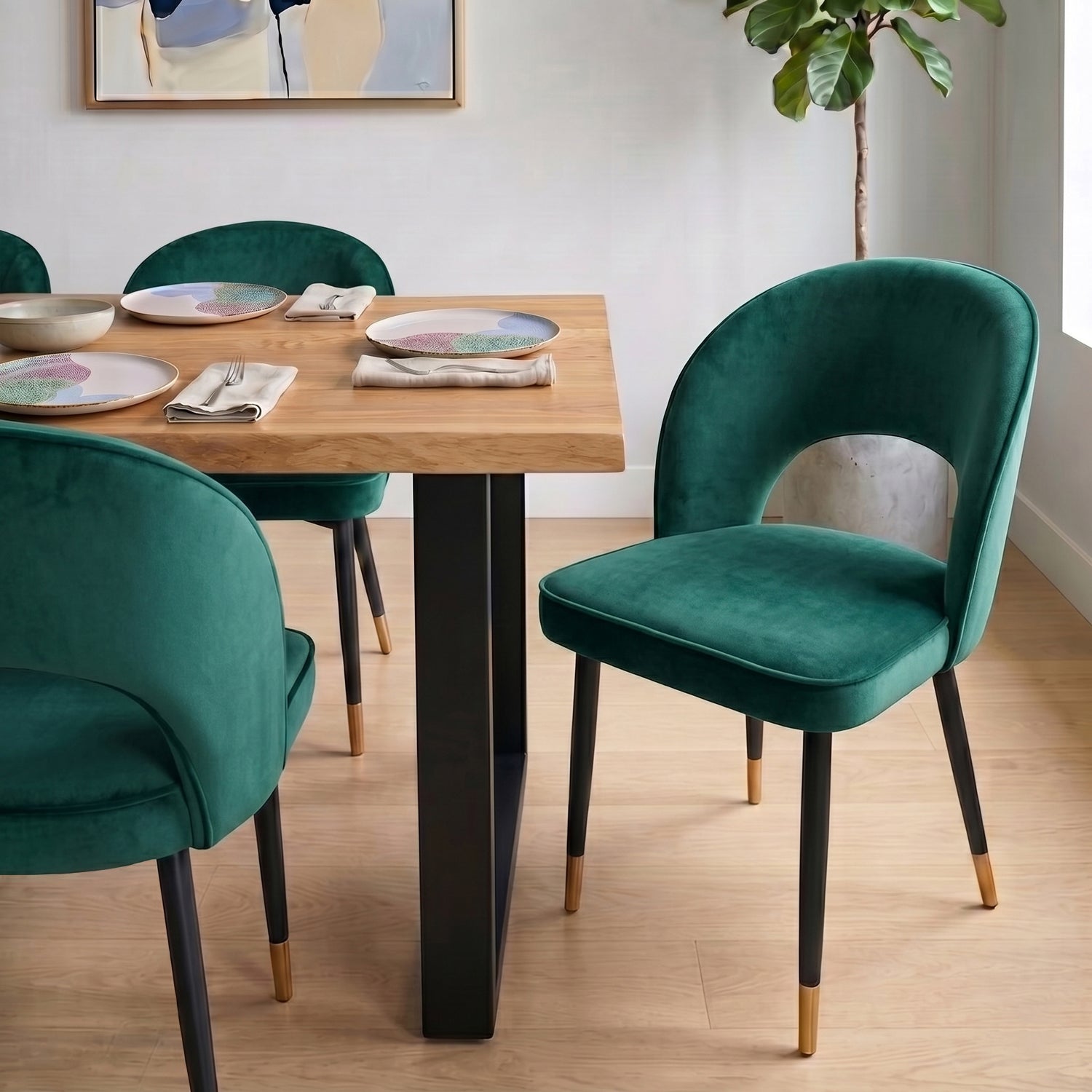 A curved velvet dining chair with a calm, sculptural feel