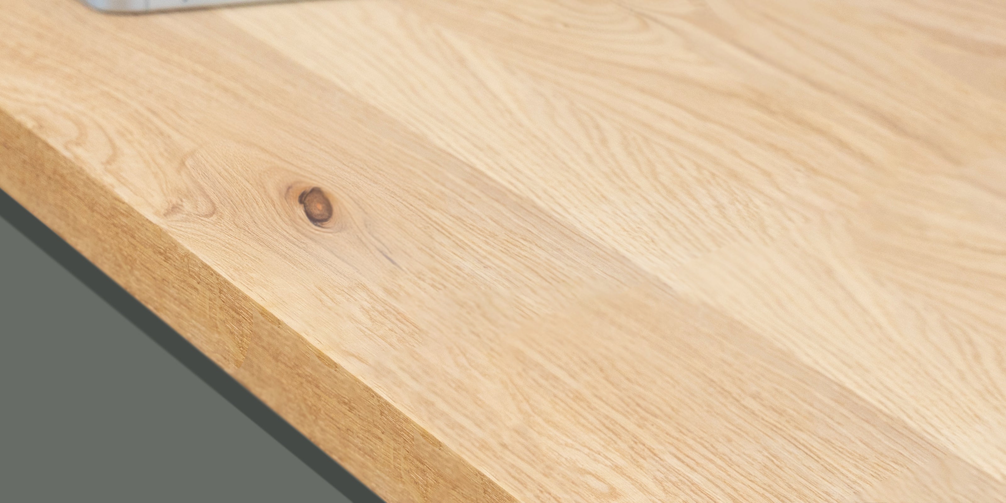 Full stave oak worktop showing natural knots and grain.