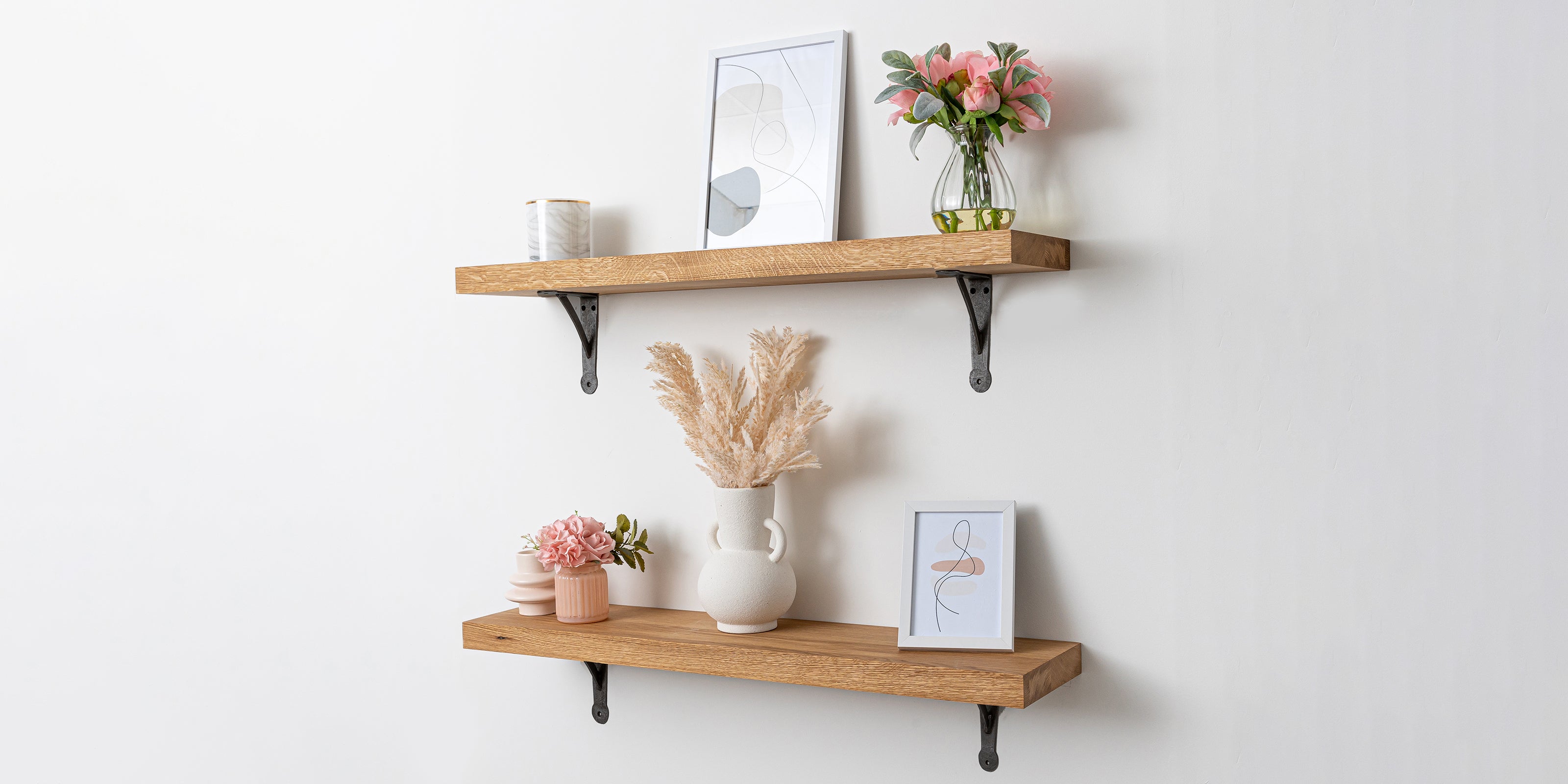 40mm thick full stave prime oak shelves with decorative items on a white wall