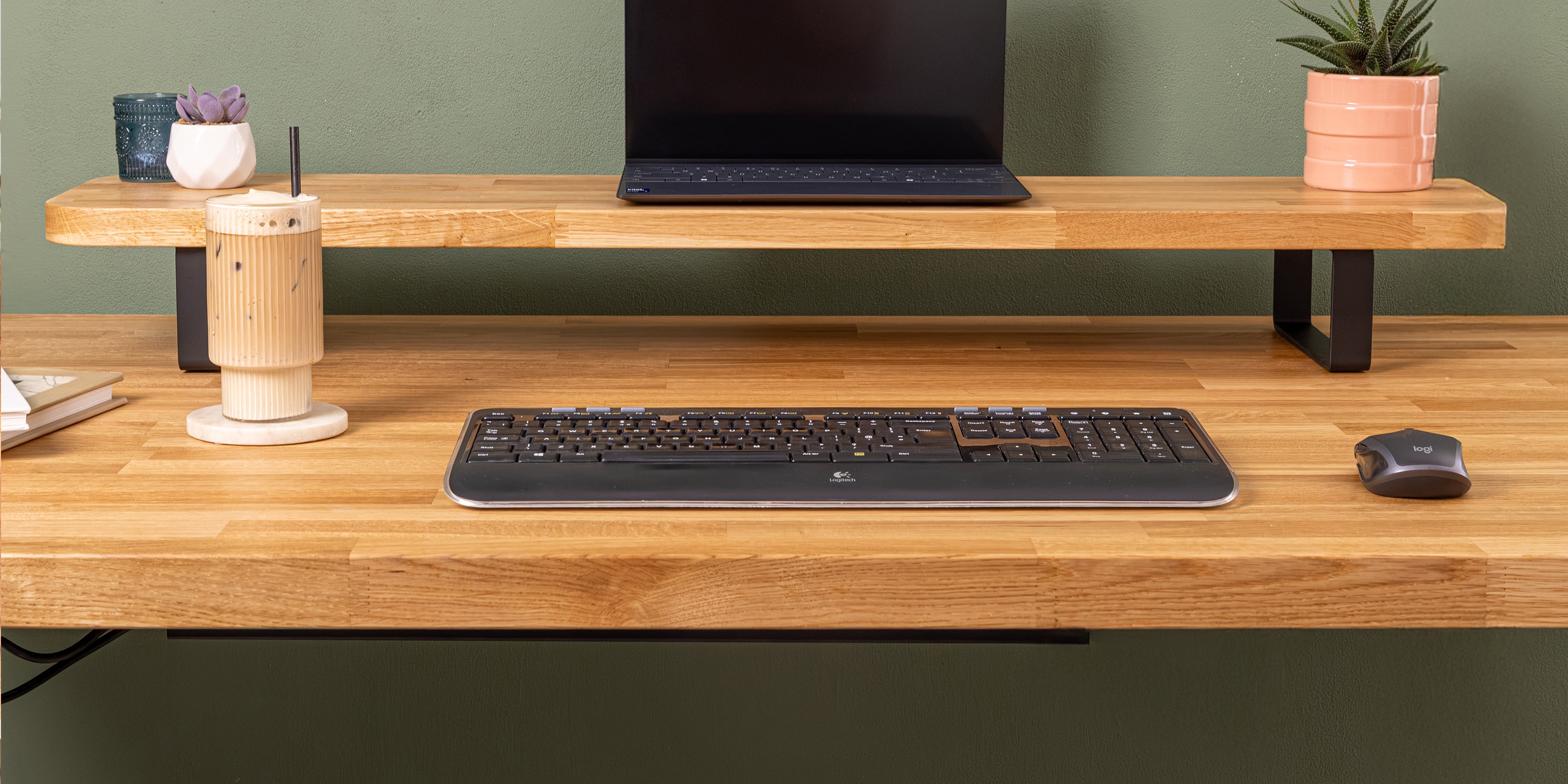 Solid prime oak monitor stand shown with a matching prime oak standing desk.