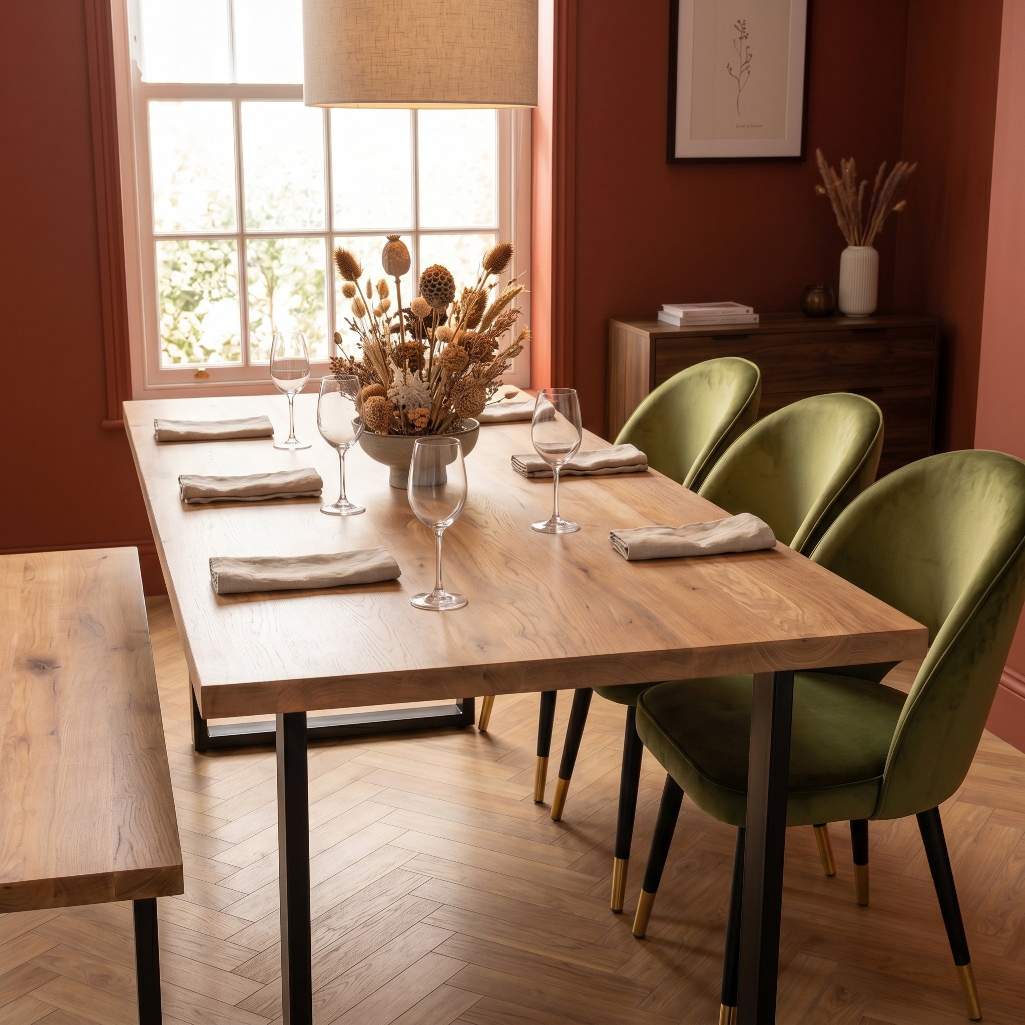 Dining room with premium wooden table, olive Corin chairs, and decorative elements.