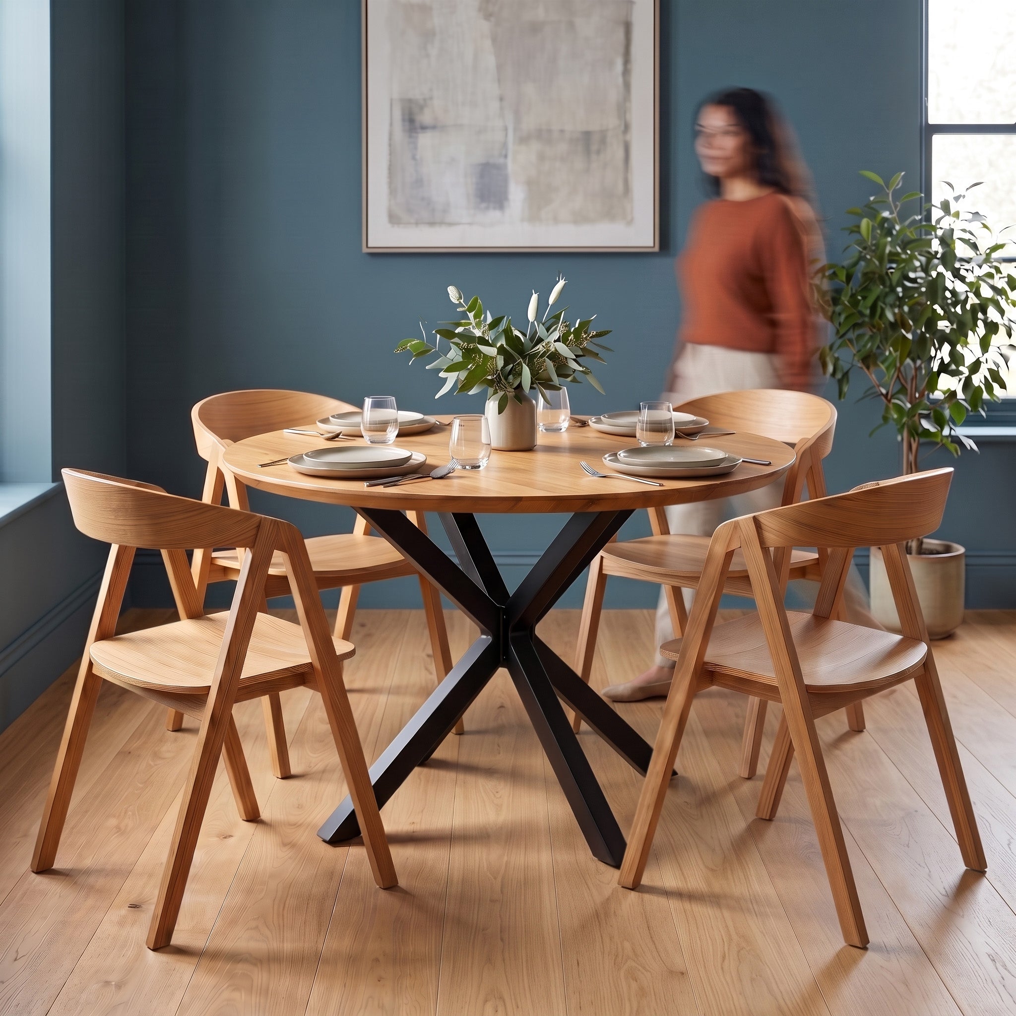 Dining room with premium wooden table and chairs, woman in the background