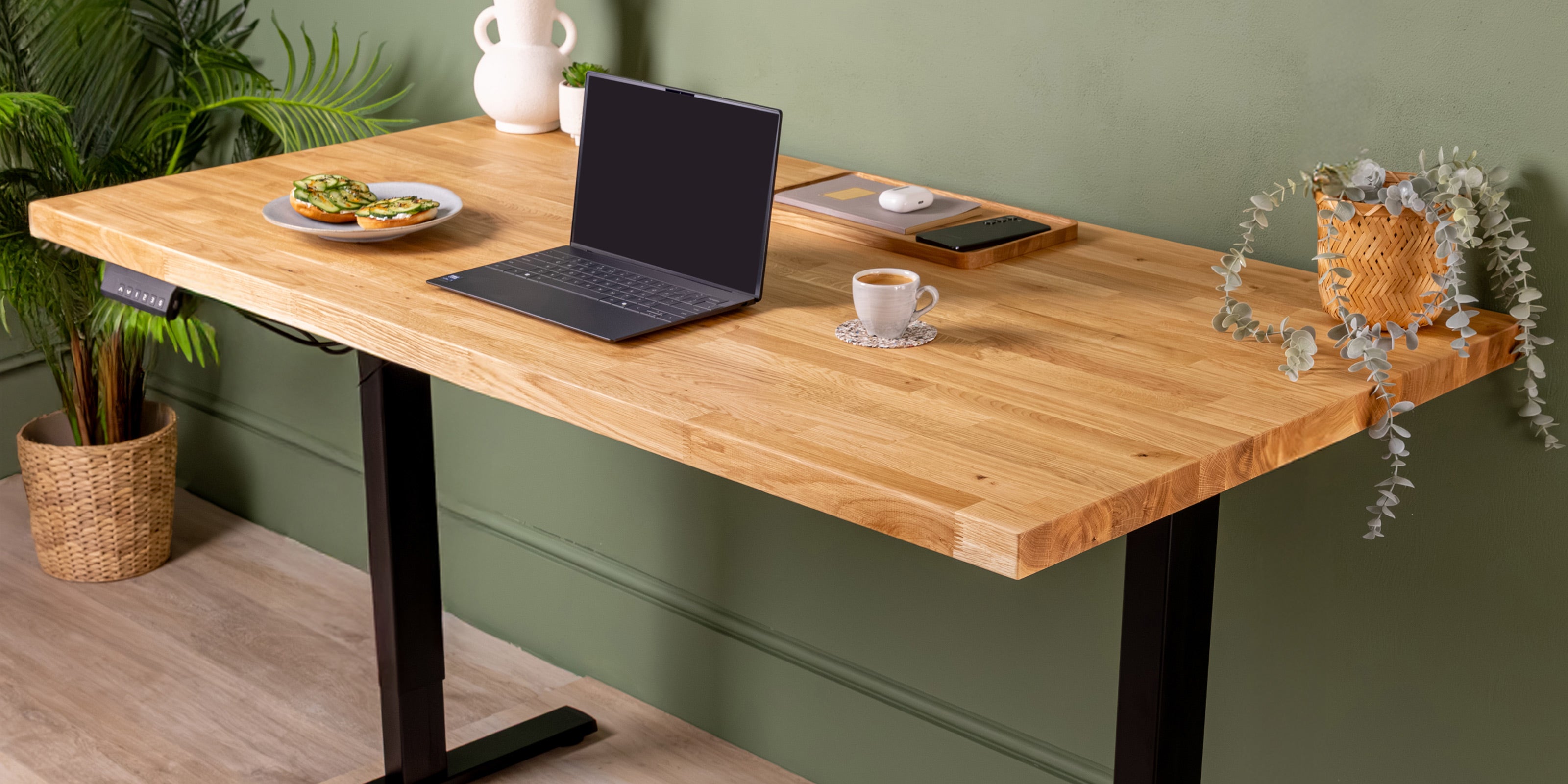 Solid oak desk with d2 black standing desk frame. 